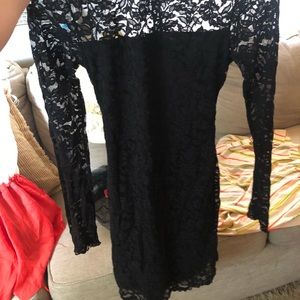 Black lace knee length fitted dress, long sleeve